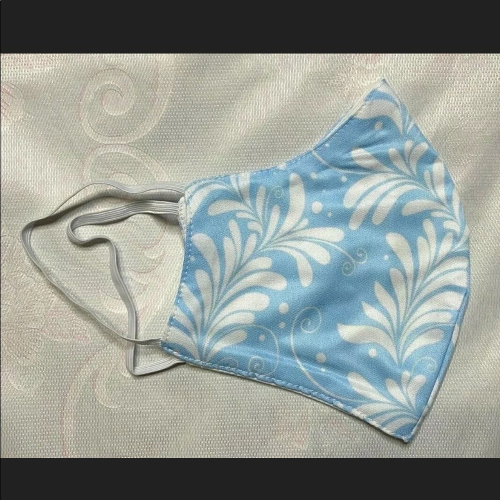 Light blue and white face mask